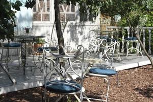 Classic furniture, metal table chairs in the summer Park. photo