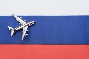 Flag of Russia and the plane. The concept of travel. photo