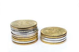 Two stacks of bitcoins on a white background.