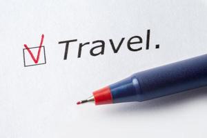 The word travel is printed on a white background. photo