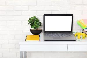 Workspace with computer and notebook. Copy space and top view. Selective focus photo