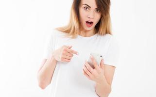 shocked look at phone, cropped portrait surprised young woman looking at smartphone seeing bad news or photos with stunned emotion on face open mouth,copy space