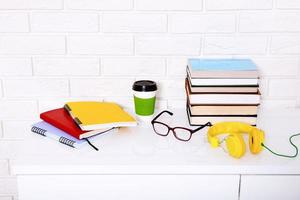 Workplace and education accessories on white table. Selective focus and copy space. Business school concept photo