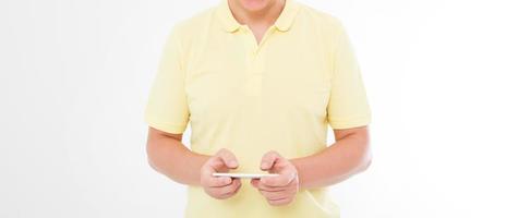man in t shirt holding smartphone isolated on white background. Mobile maketing, business concept. Copy space photo