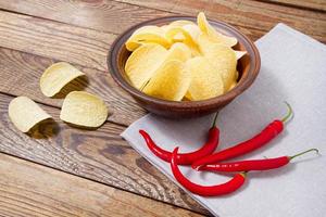 napkin,potato chips, hot pepper on table, food background, top view photo