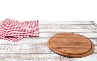 empty pizza board and tablecloth on table isolated on white background copy space photo