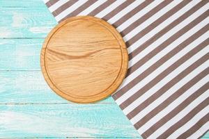 Top view striped tablecloth and plank on wooden table, mock up photo