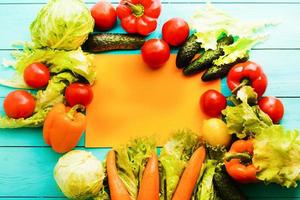 Frame of vegetables with orange copy space. Top view and selective focus