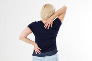 Woman female back ache, back pain, Female body showing pain in back spine.Medical concept,Middle age Woman standing in white and touching her back copy space photo