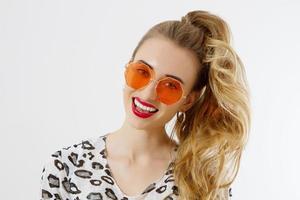 Close-up woman face. Fashion female closeup in trendy clothes isolated on white background. Summer fun time and summertime accessories. Funny girl. photo