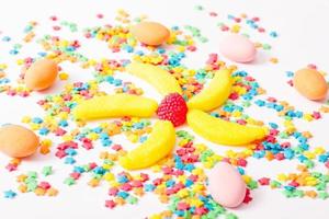 Colorful candy, lollipop and sweets isolated on white background. Top view. Selective focus. photo