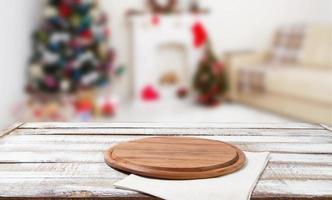 cutting desk,white napkin on wooden table on blurred holiday interior, new year and christmas concept, tablecloths photo