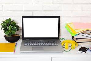 Workspace with computer and notebook. Copy space and top view. Selective focus photo