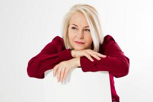 Sad lonely middle age woman. female depression, Portrait of a middle aged woman sitting in a chair and looking sad, Woman looks sad and dejected, upset at something photo