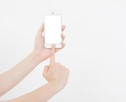 Hand holding white cellphone isolated on white clipping path inside. Online shopping. Top view. Mock up. Copy space. Template.Blank. photo