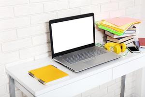 Workspace with computer and notebook. Copy space and top view. Selective focus photo