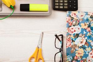 Creative workspace with work accessories and copy space on wooden table. Top view photo