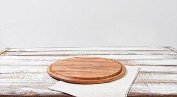 empty wooden desk, pizza,grow napkin on table photo