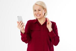 Middle-aged woman hold phone, middle age pretty woman video chatting smartphone with family isolated copy space photo