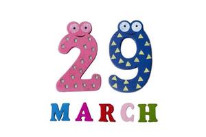 March 29 on white background, numbers and letters. photo