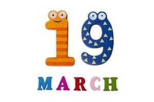 March 19 on white background, numbers and letters. photo