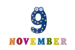 November 9 on white background, numbers and letters. photo