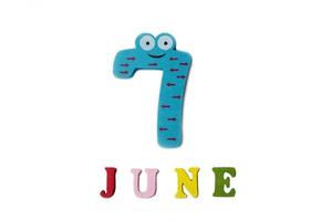 The number seven and the word June on a white background. photo