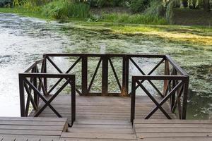 Fishing pier on the river on a summer day. photo