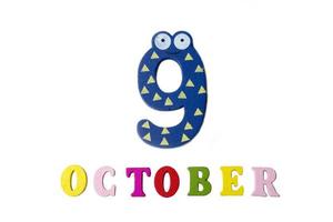 October 9 on white background, numbers and letters. photo