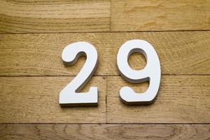 Figure twenty-nine on the wooden, parquet floor. photo