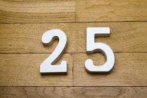 Figure twenty-five on a wooden, parquet floor. photo