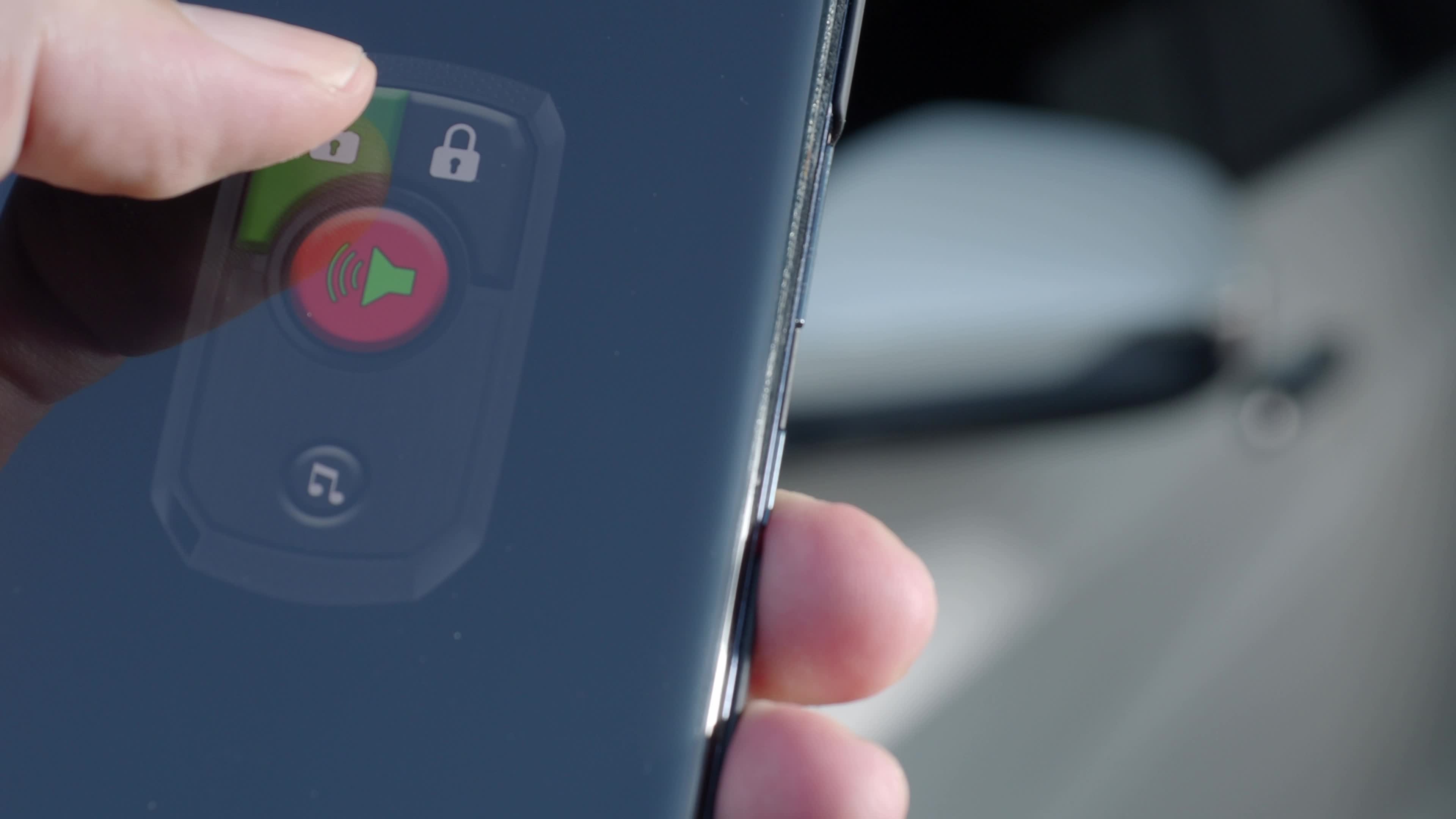 Unlock and lock Car Using Smartphone App. Man hand Unlocking car