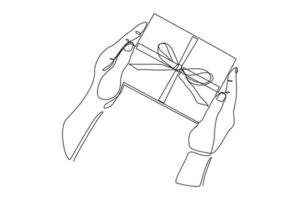 Continuous line drawing of hand holding gift box with ribbon. Single one line art of birthday surprise and christmas box. Vector illustration