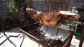 The Calf roasting on a Spit covered with a Crispy golden brown