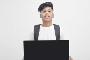 Indian college student showing board on white background. photo