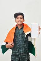 young indian man celebrating independence day or republic day and using smartphone photo