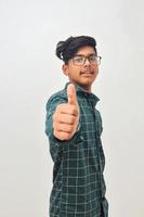 Young indian man showing thump up. photo