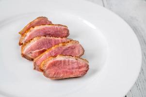 Sliced duck breast photo