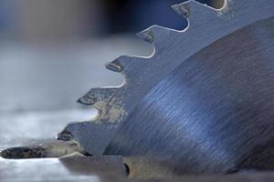 Silver circular saw in the garage at work photo