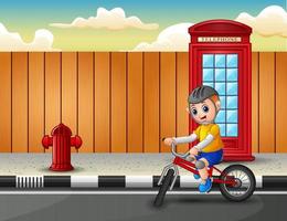 A boy rides a bicycle on the highway vector