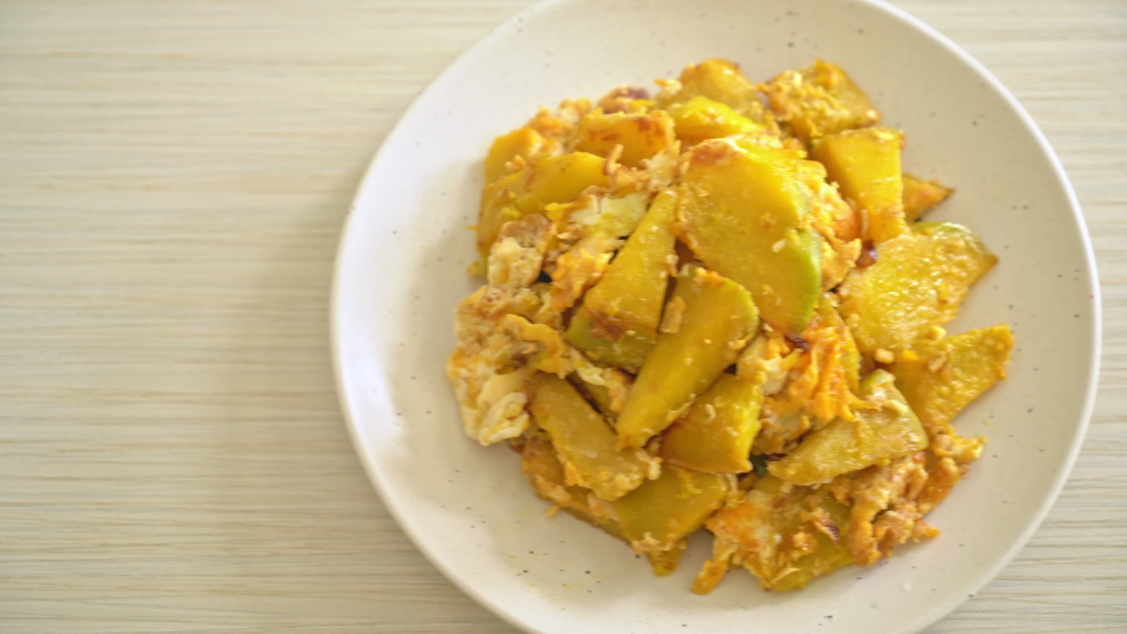stirfried pumpkin with egg 5220660 Stock Video at Vecteezy