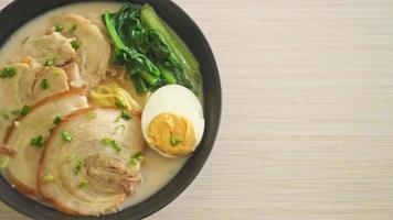 Ramen noodles in pork bone soup with roast pork and egg or Tonkotsu ramen noodles - Japanese food style video