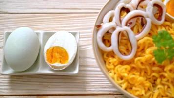 instant noodles bowl with salt egg and squid