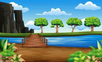 River and wooden bridge in a beautiful nature vector