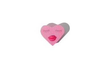 heart shaped gift box with lips and eyelashes isolated on white photo