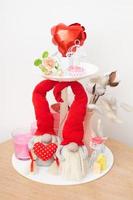 Still life for Valentines Day with two gnomes, gifts and candles for home decoration photo