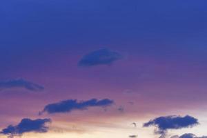 Beautiful purple background with evening sky and clouds photo