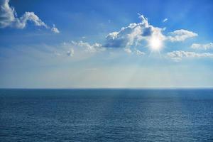 Seascape with beautiful sky and sun rays.
