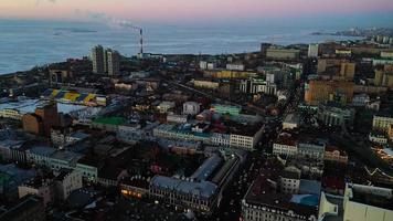 Vladivostok, Russia - January 7, 2022-Aerial view of the urban landscape with a view of the embankment near the Amur Bay. photo