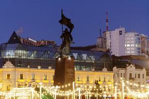 Vladivostok, Russia - January 5, 2022- Cityscape with a view of New Year's Square with festive illumination. photo